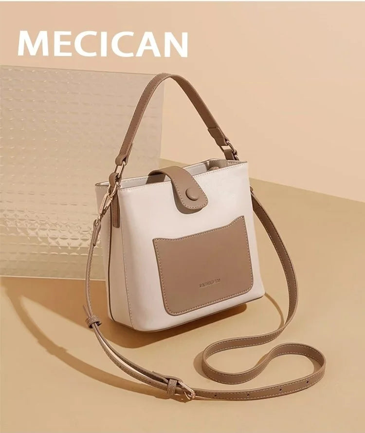 Un sac tendance avec un design bicolore contrasté et une large bandoulière.